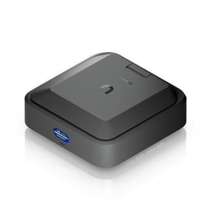 Ubiquiti U-AirWire UniFi AirWire elevated three-quarter view showing folded Super Antenna panel, front display and side vent