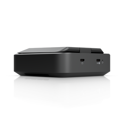 Ubiquiti U-AirWire UniFi AirWire rear three-quarter view with folded antenna, USB-C ports and side ventilation