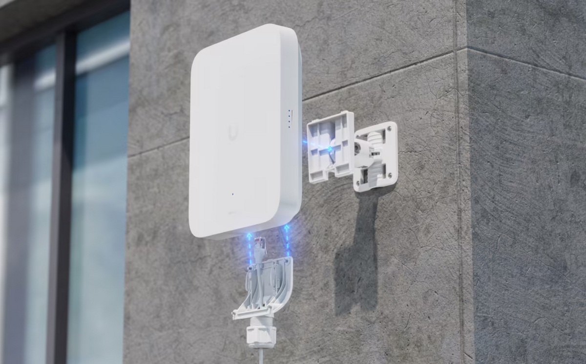 Ubiquiti U5G-Max-Outdoor UniFi 5G Max Outdoor exploded wall-mount installation showing bracket alignment, Ethernet connection and cable gland cover assembly.
