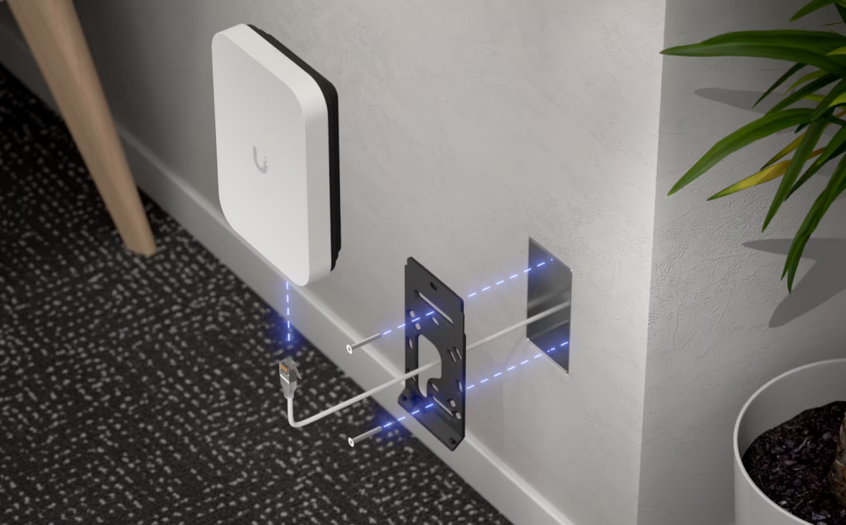 Ubiquiti U7-Pro-XG-Wall UniFi U7 Pro XG Wall exploded installation over a recessed wall box with mounting bracket, screws and Ethernet cable