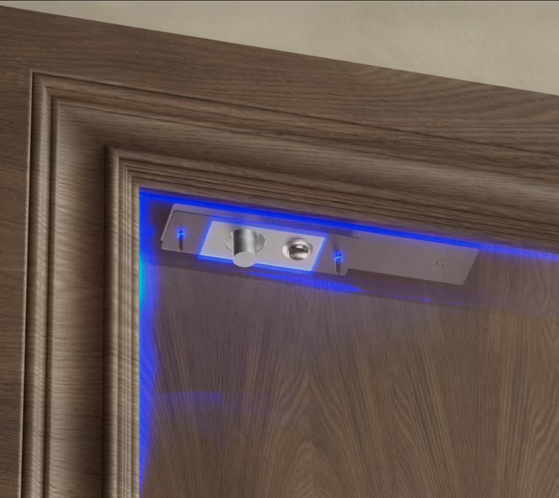 Ubiquiti UACC-Lock-Bolt-Secure UniFi Fail-Secure Bolt Lock installed in a wooden door frame with illuminated access indicator