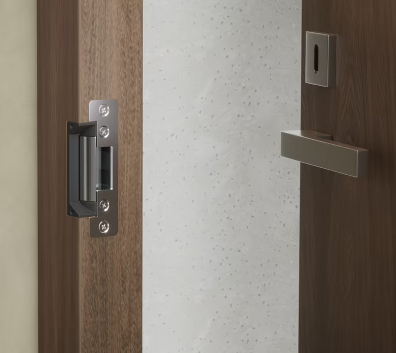Ubiquiti UACC-Lock-Strike-Safe-15mm UniFi Standard 15mm Fail-Safe Strike Lock installed with a short faceplate in a timber door frame