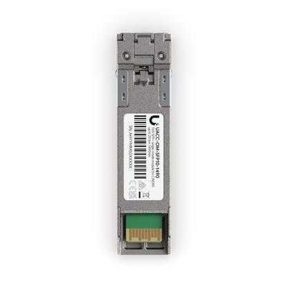 Top view of Ubiquiti UACC-OM-SFP10-1490 UniFi 10G CWDM Single-Mode Optical Module showing the barcode label, latch and gold edge connector