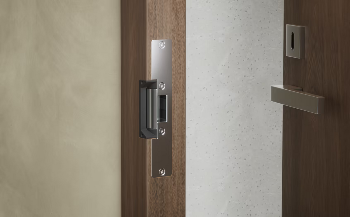 Ubiquiti UACC-Lock-Strike-Secure-15mm UniFi Standard Fail-Secure Strike Lock installed with the long front plate in a timber door frame.