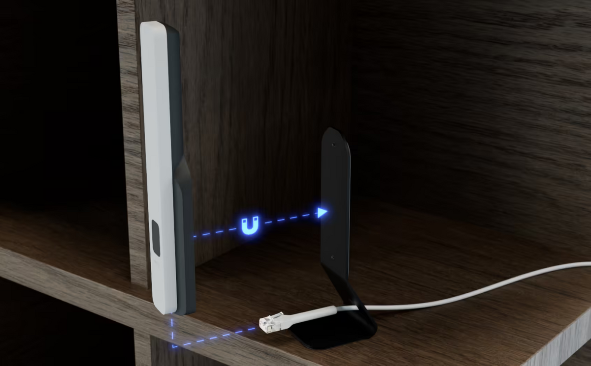 Ubiquiti U5G UniFi 5G Backup desktop stand assembly showing magnetic attachment and Ethernet cable routing