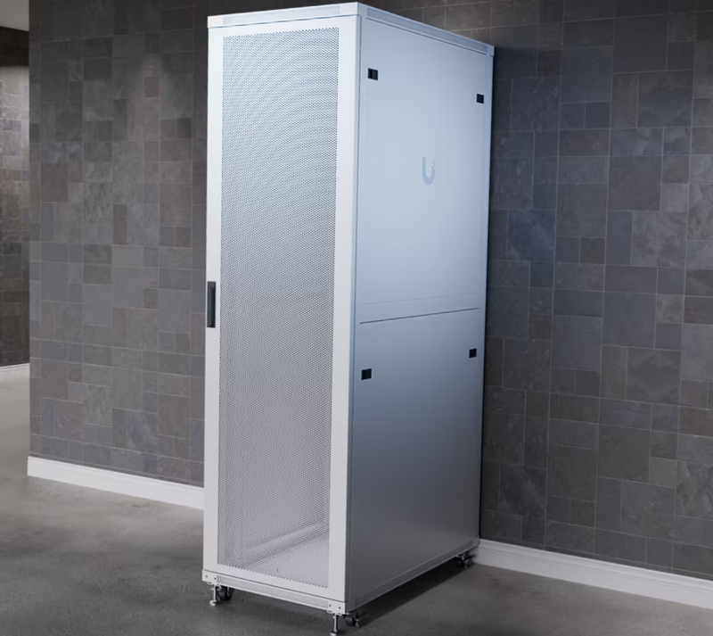Ubiquiti UACC-Rack-42U-1000-P UniFi 1000mm 42U rack cabinet installed on caster wheels with perforated front door and solid side panels.