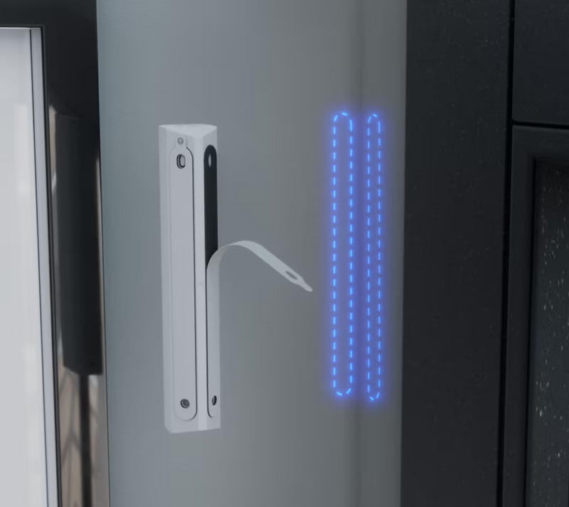 Ubiquiti USL-GlassBreak sensor with protective backing removed from dual adhesive mounting strips