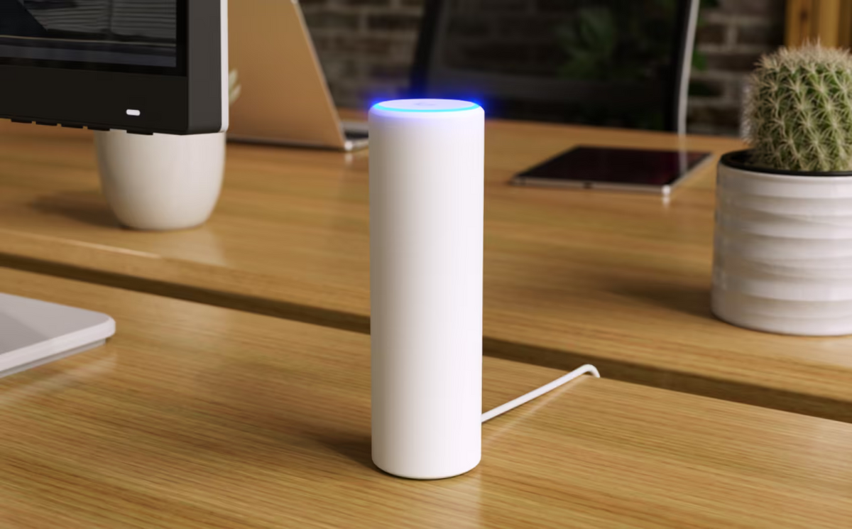 Ubiquiti U7-Mesh UniFi U7 Mesh WiFi access point on a timber desk with an illuminated top LED ring.