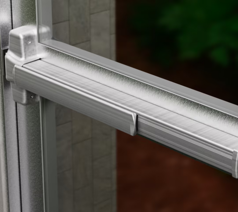 Ubiquiti UACC-PanicBar UniFi Panic Bar installed across a framed glass door, showing the horizontal push rail and latch housing.