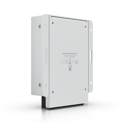 UniFi Retrofit PSU 12V rear angled view with product label, mounting plate and slotted fixing points