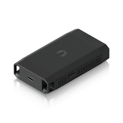Rear angled view of the UACC-SFP-Wizard showing the USB-C charging port, textured casing and power button