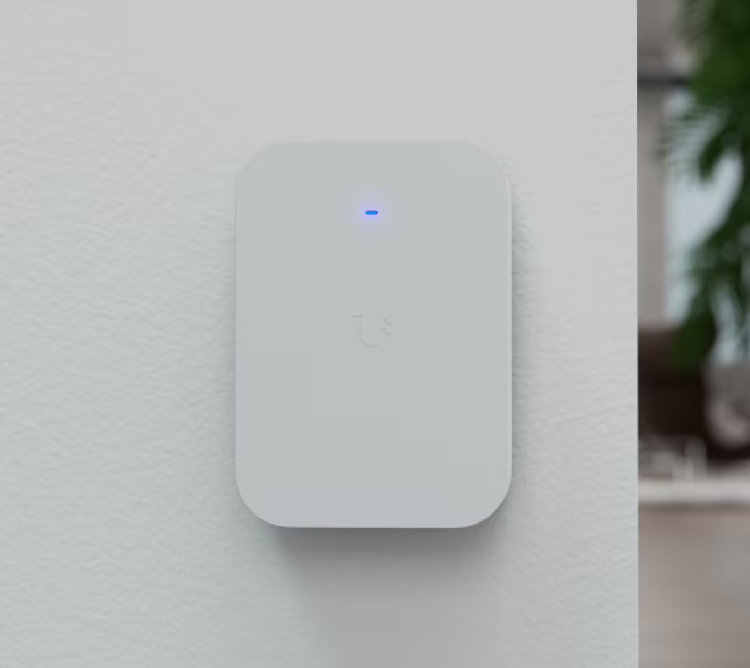 Ubiquiti UniFi U7 Pro XG Wall Paintable Cover installed on a white interior wall