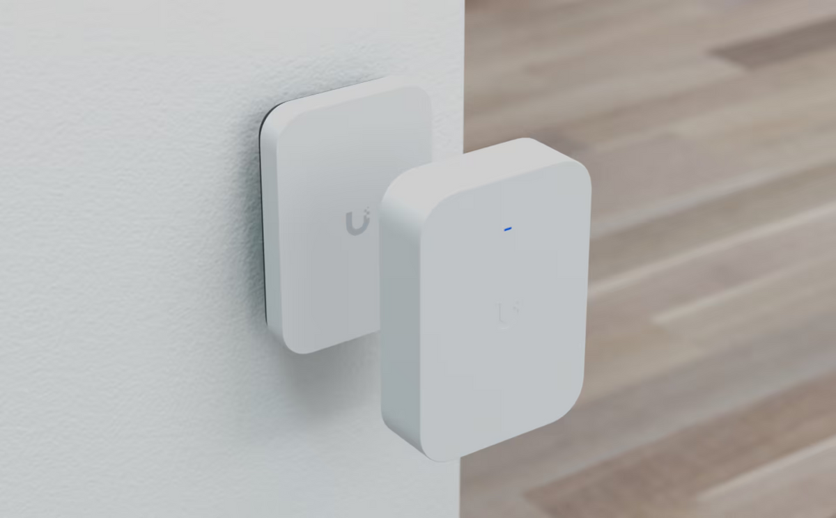UniFi U7 Pro XG Wall Paintable Cover shown removed from the wall-mounted access point