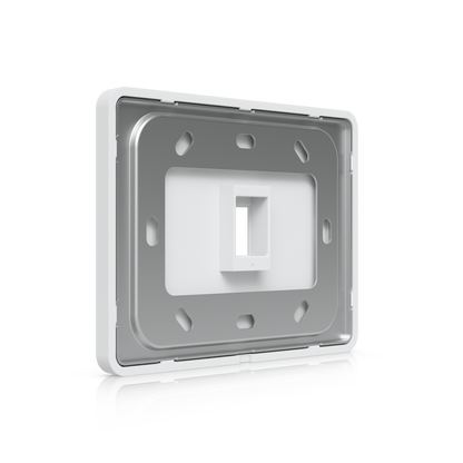 Angled rear view of Ubiquiti UACC-WP-Keystone wall plate with mounting frame and keystone opening
