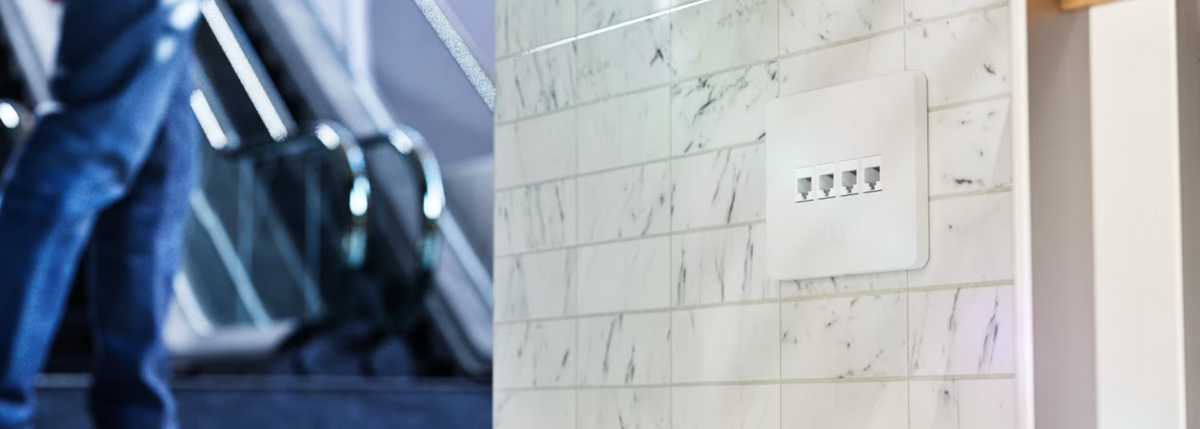 Ubiquiti UniFi UACC-WP-Keystone paintable wall plate with four horizontal keystone ports installed on a tiled wall