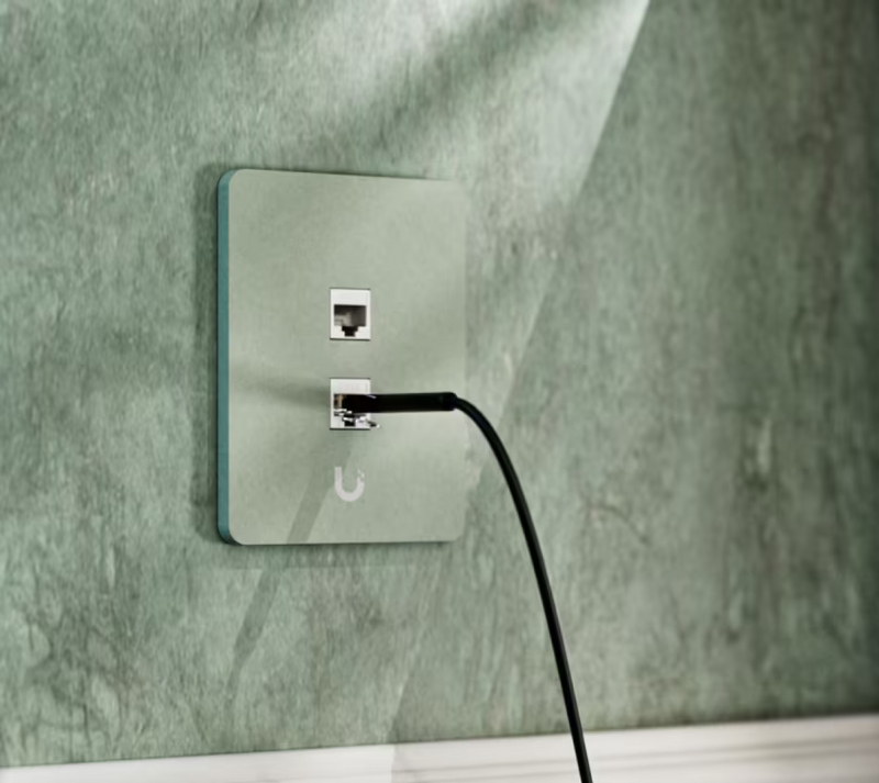 Ubiquiti UniFi vertical two-port paintable keystone wall plate with an Ethernet cable connected to the lower port