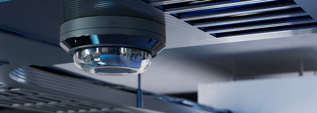 Ubiquiti UVC-AI-MS-4 UniFi AI Multi Sensor 4 Black installed on a slatted commercial ceiling