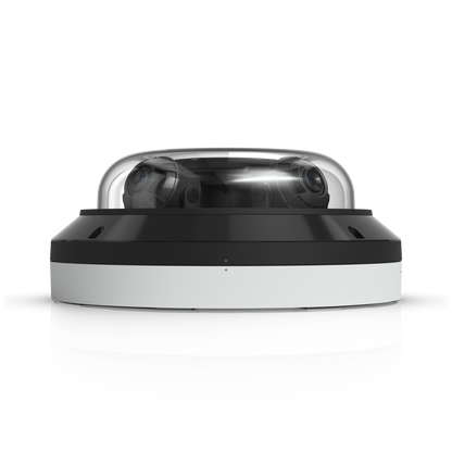 Ubiquiti UVC-AI-MS-4 white dome camera viewed from the side with dual lenses visible through the cover