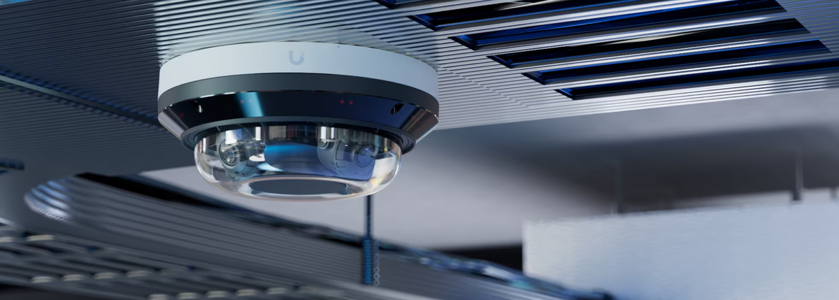 Ceiling-mounted Ubiquiti UVC-AI-MS-4 UniFi AI Multi Sensor 4 White in a commercial interior